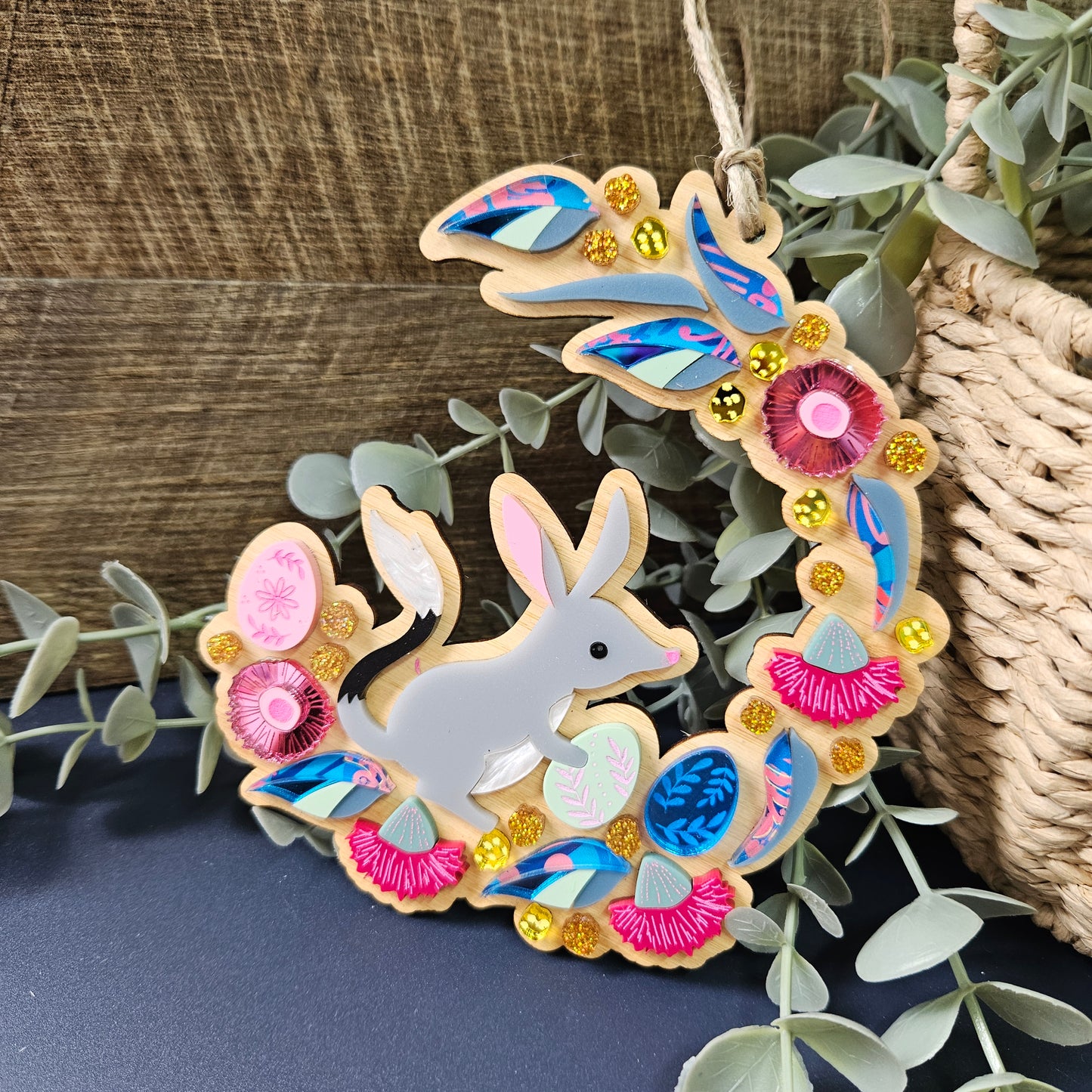 Australian Bilby Easter wreath ornament showcasing a native bilby amidst native Australian flora, crafted from eco-friendly materials, perfect for celebrating Easter with an Australian twist